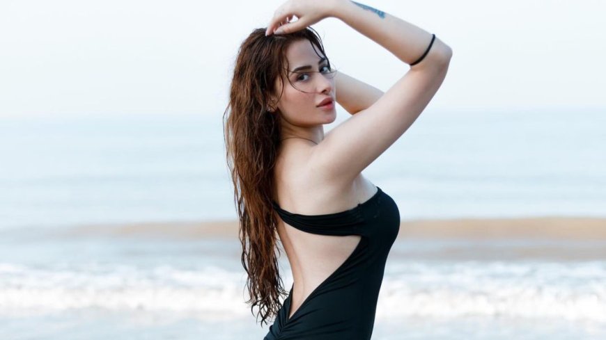 Mahira Sharma Stuns In Black Backless Dress, Radiating Charm & Confidence With Her Sizzling Beach Look